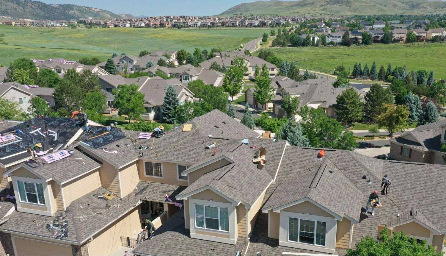 Local roofers near you Local roofers working on homes in a neighborhood near you