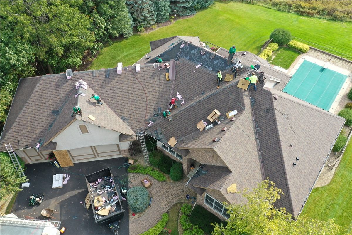 Local roofing contractors performing professional storm damage roof inspection in northern New Jersey