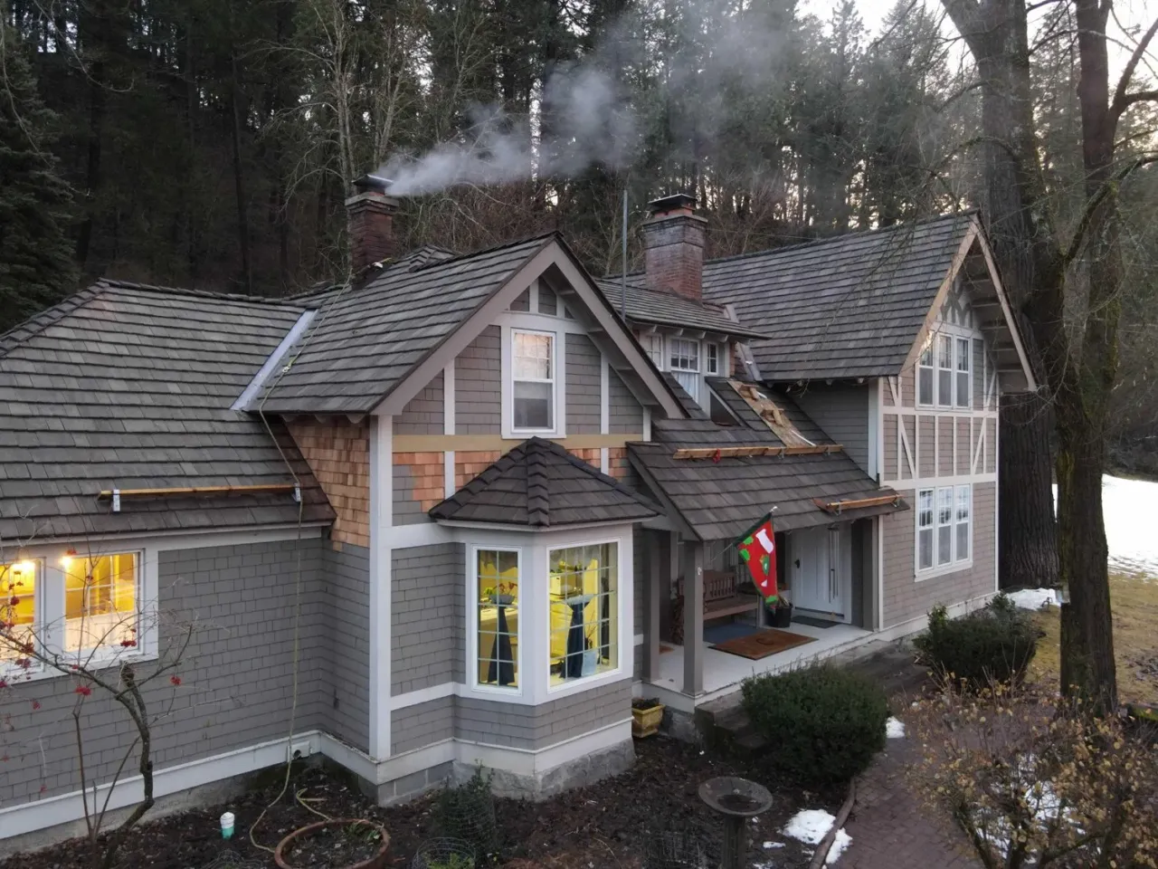 Residential roofing contractors replacing seamless metal roofing system on a house near Sparta New Jersey