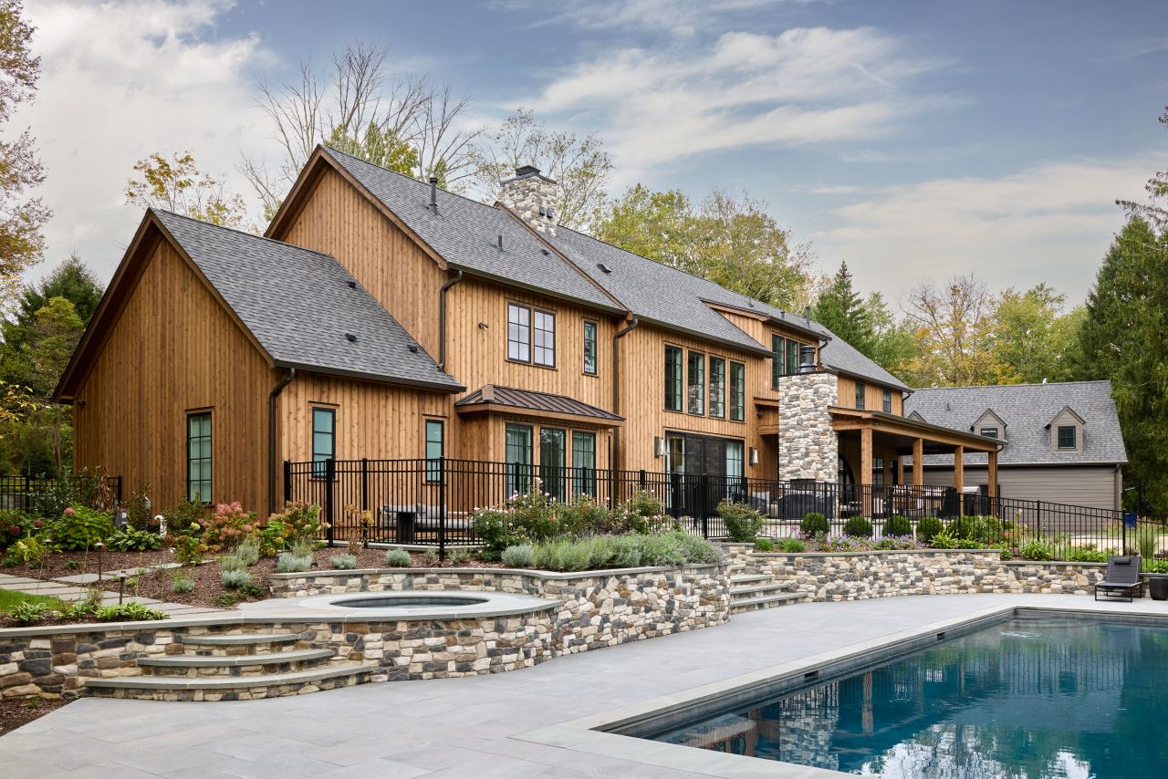 Complete home exterior remodeling including new siding, masonry steps, and roof installation.