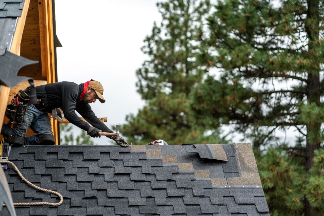 Close-up view of newly installed architectural roofing shingles with precise flashing layout.
